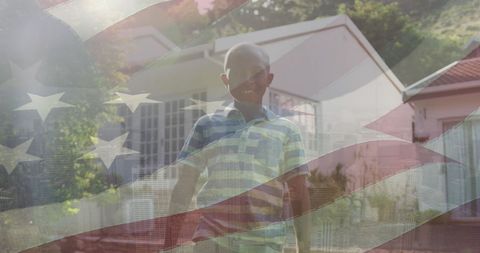 Boy Smiling Outside House with American Flag Overlay