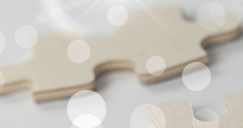 Beige Puzzle Pieces with Bokeh Highlights Concept - Download Free Stock Images Pikwizard.com