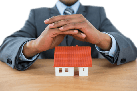 Businessman Covering Small House Model with Hands on Table Transparent Background - Download Free Stock Videos Pikwizard.com