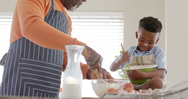 Grandfather and Young Boy Baking Together in Kitchen - Download Free Stock Images Pikwizard.com