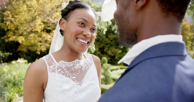 Happy Bride Smiling at Groom During Outdoor Wedding Ceremony - Download Free Stock Images Pikwizard.com