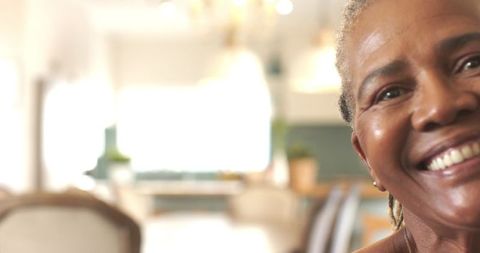 Elderly Woman Smiling in Elegant Kitchen Ambiance