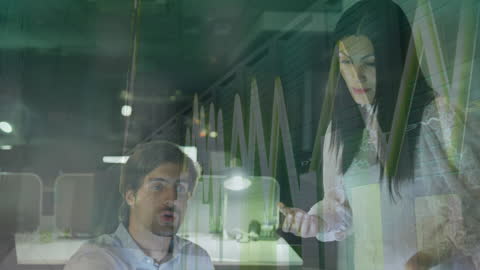 Business People Analyzing Financial Data with Graphs Overlay