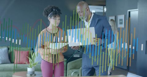 Business Professionals Analyzing Virtual Financial Graphics in Office