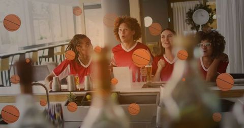 Diverse Friends Cheerfully Watching Basketball Game at Bar