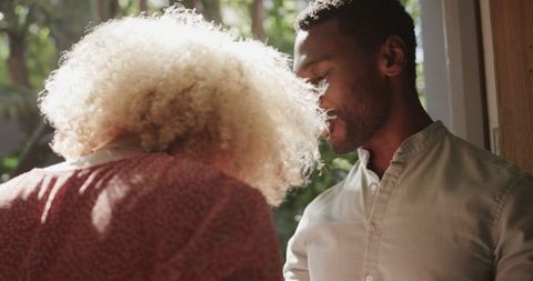 Friends Socializing and Enjoying Leisure Time in Sunny Garden