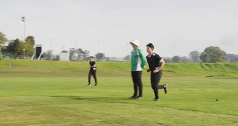 Cricket Players Focused on Strategy During Practice Session