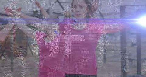 Fitness instructor leading outdoor workout in park