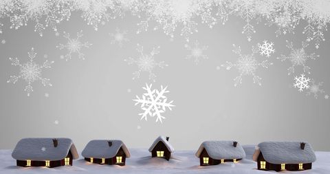 Winter Wonderland with Quaint Snow-Covered Cottages and Falling Snowflakes