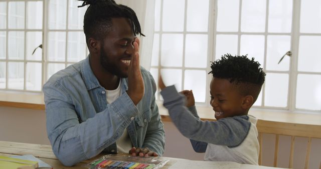 Father and Son Enjoy Quality Time with High-Five - Download Free Stock Images Pikwizard.com