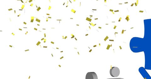 Gold confetti falling on group with puzzle piece