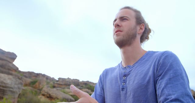 Man Contemplating Outdoors in Natural Rocky Landscape - Download Free Stock Images Pikwizard.com