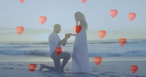 Romantic Beach Proposal Man Kneeling Red Heart Balloons Sunset