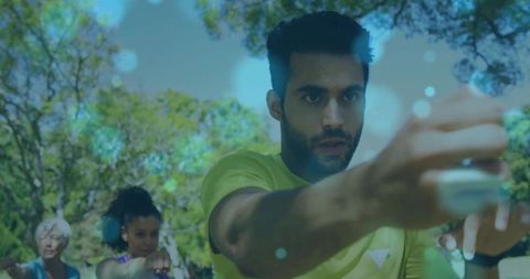 Dynamic outdoor fitness class in leafy park setting