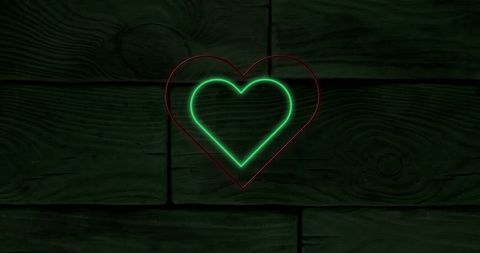 Neon Hearts Glowing on Dark Wooden Background