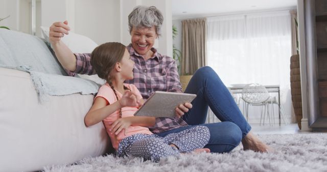 Grandmother and Granddaughter Exploring Tablet at Home - Download Free Stock Images Pikwizard.com