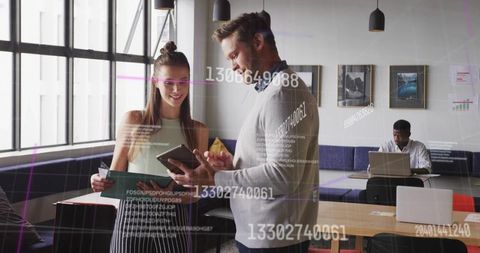 Diverse Office Team Analyzing Tech Solutions with Digital Overlay