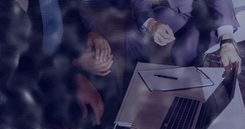 Executives Discussing Strategy Over Laptop in Corporate Lounge