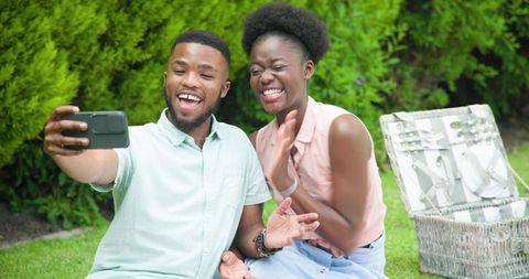Happy Couple Taking Selfie in Garden