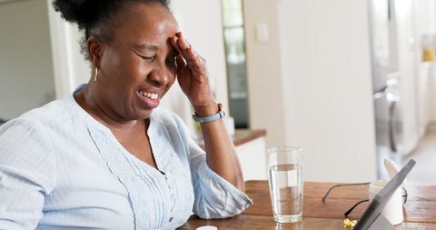 Senior Woman Managing Health at Home with Technology and Medication - Download Free Stock Images Pikwizard.com