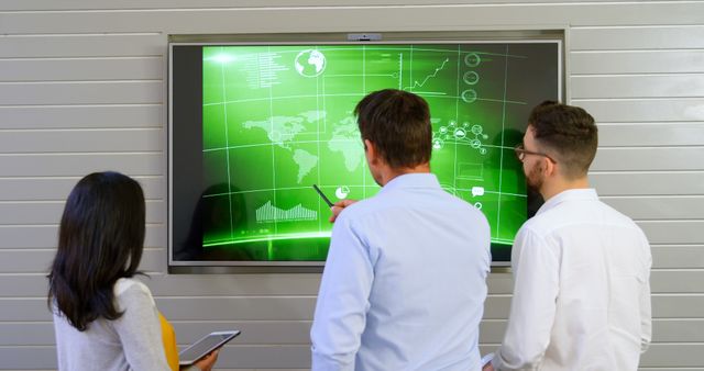 Team Analyzing World Map on Digital Screen in Modern Office - Download Free Stock Images Pikwizard.com