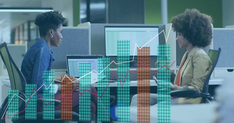 Diverse Business Team Analyzing Digital Data and Graphs in Modern Office