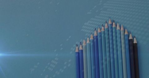 Creative Composition of Blue Pencils on Textured Surface