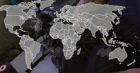 Technician soldering electronics wearing dark jacket with global network overlay and hex clusters