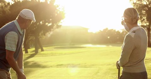 Couple Enjoying Golf on a Sunny Day - Download Free Stock Images Pikwizard.com