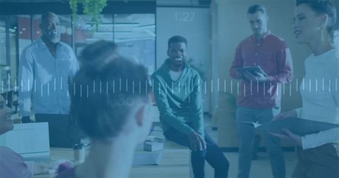 Diverse Team Engaging in Dynamic Business Meeting