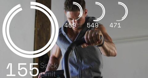 Pedaling fan bike wearing sleeveless zip hoodie with futuristic fitness hud cardio readout