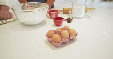 Cozy Couple Baking at Home with Eggs and Flour