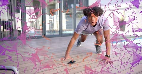 Reaching for smartphone during intense outdoor workout on deck wearing smartwatch