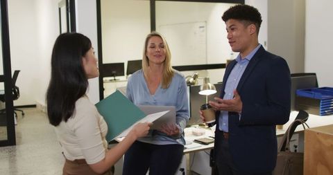 Diverse Team Engaging in Office Project Discussion