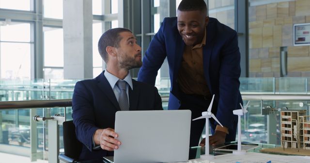 Business Professionals Discussing Renewable Energy Projects on Laptop - Download Free Stock Images Pikwizard.com