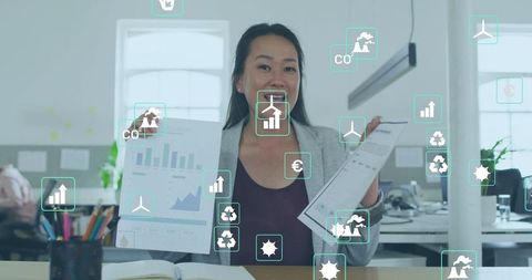 Korean businesswoman presenting sustainability dashboard and data reports at office