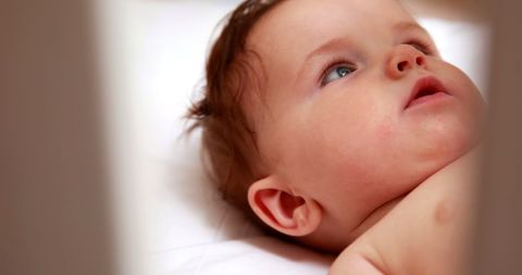Adorable Baby Gazing Upward from Crib Seeking Exploration - Download Free Stock Images Pikwizard.com