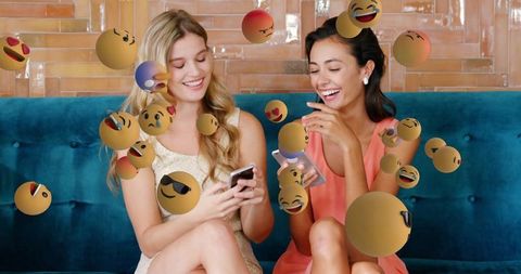Friends Sharing Fun Moments with Floating Emoji Symbols