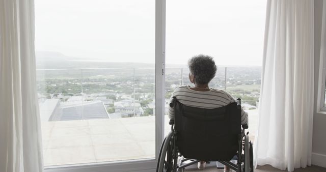 Senior Woman in Wheelchair Looking Out of Large Window at Scenic View - Download Free Stock Images Pikwizard.com