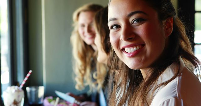 Women Enjoying Refreshments in Café, Smiling - Download Free Stock Images Pikwizard.com