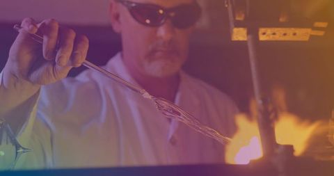 Glass Blowing Craftsman skillfully Shaping Molten Glass