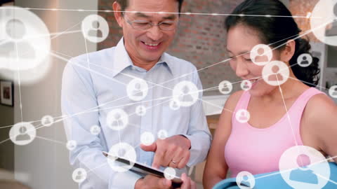 Connected Couple Exploring Digital Network on Tablet