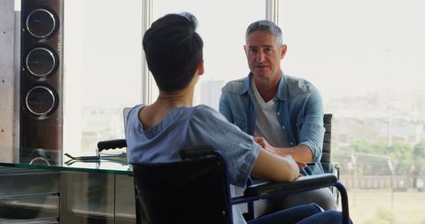 Two Business Professionals Collaborating in Modern Office