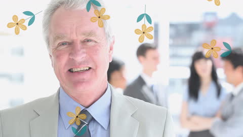 Smiling Mature Businessman with Diverse Team Background