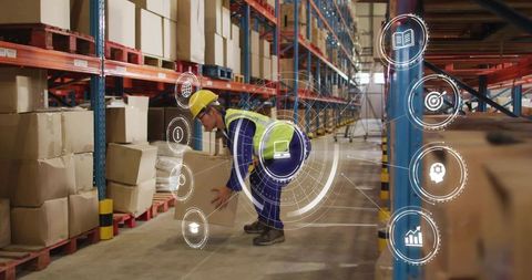 Mature Korean Warehouse Worker Lifting Box with Augmented Reality HUD for Logistics