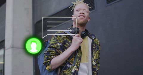 Man with Backpack and Headphones in Urban Setting