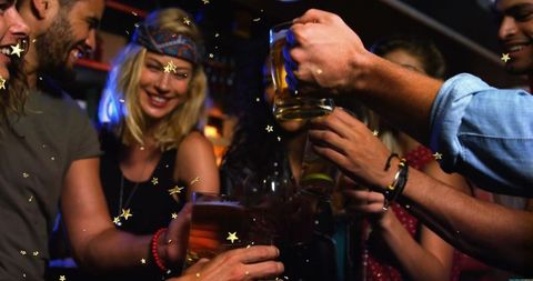 Friends Celebrating with Toast at Festive Night Party