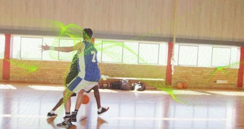 Fast-break basketball action dribbling guard in blue jersey driving past defender at speed