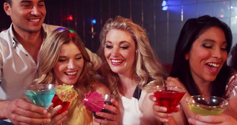 Joyful Young Adults Celebrating at Vibrant Cocktail Party - Download Free Stock Images Pikwizard.com
