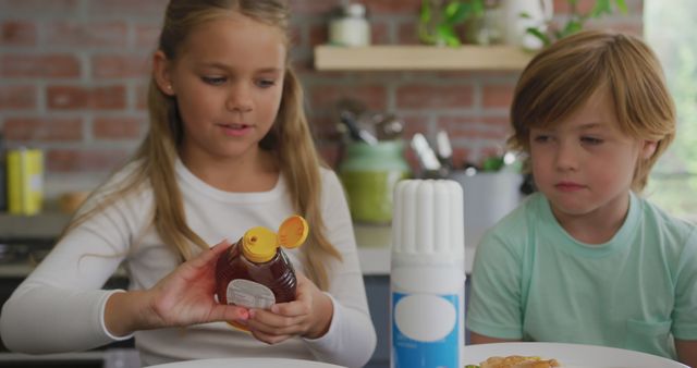 Kids making breakfast with honey and pancakes - Download Free Stock Images Pikwizard.com